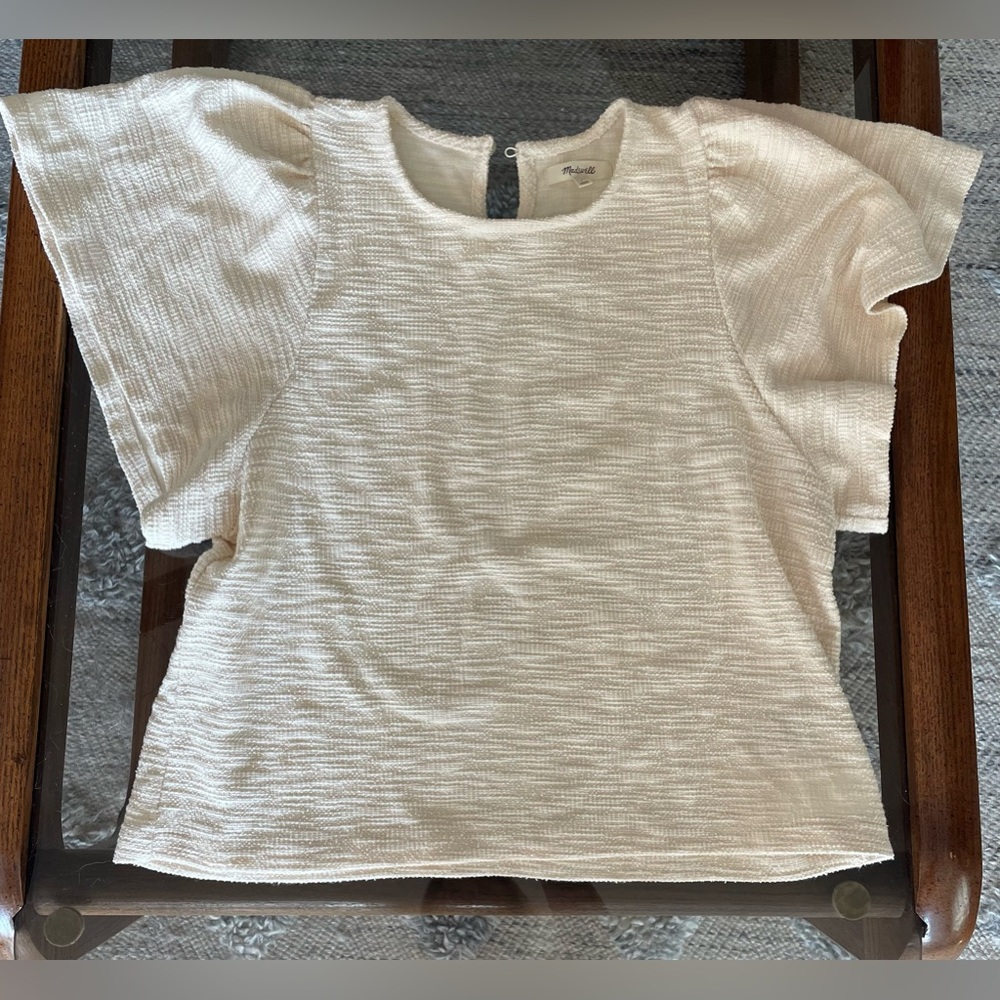 Flutter sleeve cream top